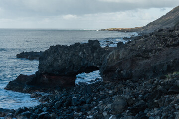 Scenic natural arch along the Kaena Point hiking trail on Oahu, Hawaii	