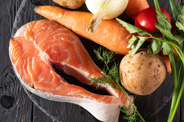 Raw Salmon Steak and Fresh Vegetables. Close-up of Healthy Ingredients.