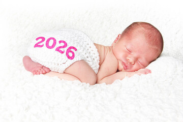 2026 New Year Baby. Newborn baby asleep on a blanket. 