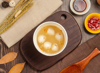 freshly made Tangyuan these sweet rice dumplings, Fish Ball Soup adorned with golden flakes, offer comfort and delight. Perfect for culinary and cultural projects.
