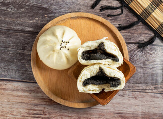 Steaming Chinese buns filled with sweet black sesame paste! Perfect for a cozy Asian-inspired snack or a delightful authentic meal experience