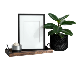 Composition features a black framed picture, plant, and serving tray with an item