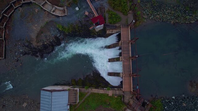 Aerial top view Chemal hydroelectric power plant with fog. Altai Siberia Russia.