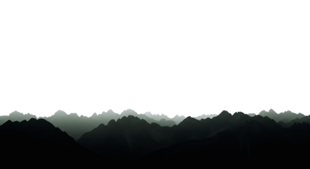 Misty mountain range silhouette against a bright white sky, creating a serene and atmospheric landscape view