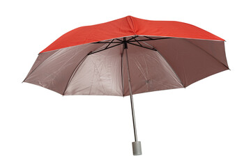 Obraz premium Bright red compact folding umbrella partially opened, featuring a silver metal shaft and a gray plastic tip, isolated on a white background. Isolated.