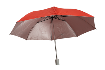 Bright red compact folding umbrella partially opened, featuring a silver metal shaft and a gray plastic tip, isolated on a white background. Isolated.