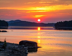 Scenic sunset over a lake, reflecting fiery colors