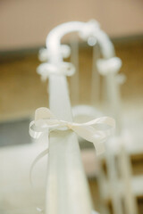 Small decorative white bows arranged for craft projects, gift wrapping