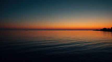 Obraz premium Serene Twilight Over Calm Waters, Beautiful Horizon with Warm Hues of Sunset and Tranquil Reflections on Still Surface of Ocean or Lake