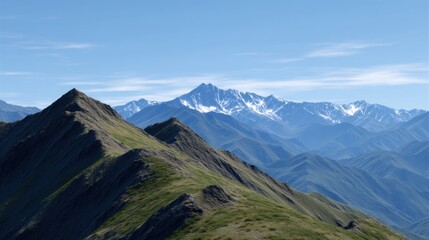 Fototapeta premium Scenic Ridgeline with Two Small Peaks in the Distant Snow-Capped Mountains