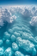 Aerial View of Fluffy White Clouds and Blue Sky Ethereal Cloudscape Scene Underneath Clear Blue Sky Majestic Cloud Formations and Sunlight Glimmering Through
