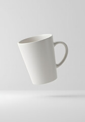 Obraz premium Minimal floating coffee cup mockup with blank logo area soft lighting and white background studio composition