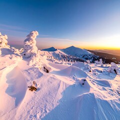 Snowy mountaintop panorama at dawn, bathed in golden sunlight