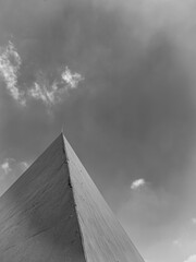 Minimal architecture black and white perspective against cloudy sky
