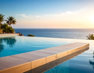 Fototapeta premium Luxurious pool overlooking the ocean at sunset