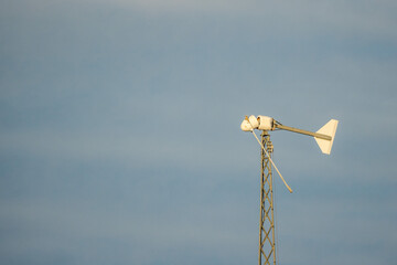 Broken wind turbine after storm damage against blue sky in the United States