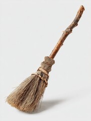 a rustic twig broom with a wooden handle and natural bristles isolated on a transparent background