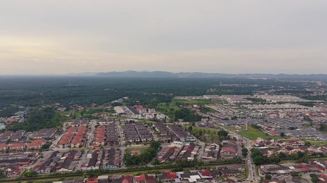 Batu Pahat Town Evening Aerial View with Scenic Mountain Backdrop, Malaysia
