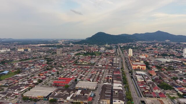 Batu Pahat Town Evening Aerial View with Scenic Mountain Backdrop, Malaysia
