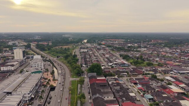 Batu Pahat Town Evening Aerial View with Scenic Mountain Backdrop, Malaysia
