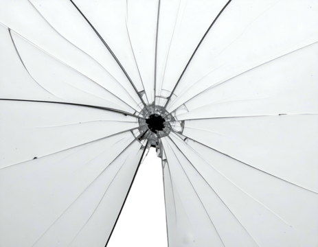 A shattered pane of glass radiating cracks outwards from a central point