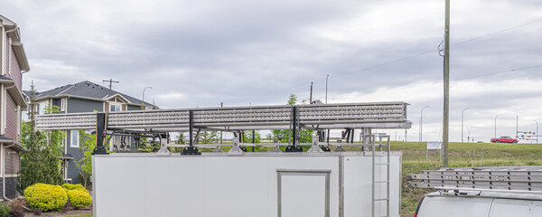 Ladder on top of business repair van trailer