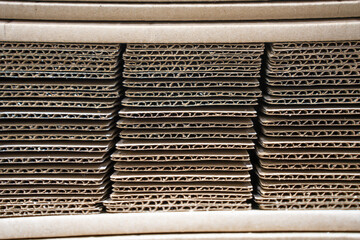 Stacks of Flat Corrugated paper boxes for shipping