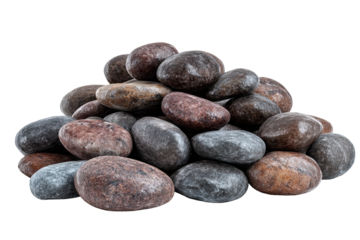 A stack of five pebbles on a pebble beach with the ocean in the background.
