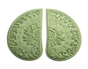 Two ornate, symmetrical, green-toned, petal-shaped halves on a black background