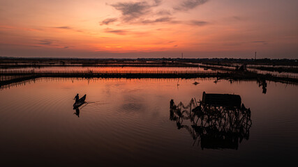 Fishermen at sunrise in Chuon Lagoon, Hue