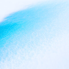 Abstract blue and white water surface with soft focus, creating a dreamy and ethereal scene