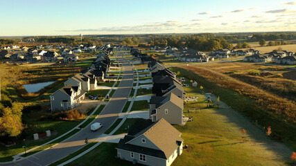 Building residential neighborhood. Aerial view of new construction houses. Establishing shot of Midwestern United States.