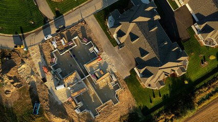 Building residential neighborhood. Aerial view of new construction houses. Establishing shot of Midwestern United States.
