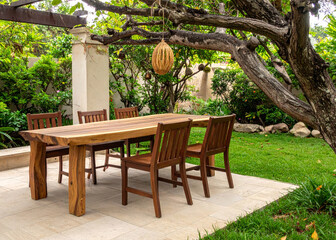 ooden dining table set in the garden area of ​​the house
