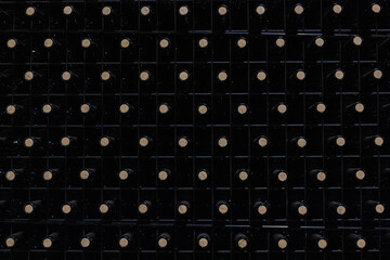 Vintage Grid: a highly geometric and repetitive photograph of the bottles arranged in perfectly aligned rows and columns