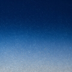 Abstract blue gradient background with sparkling effect, creating a dreamy and magical atmosphere