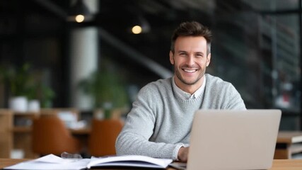 Focused Determination: A professional man radiates confidence while working diligently on his laptop, embodying a blend of productivity and sophisticated workplace charm.