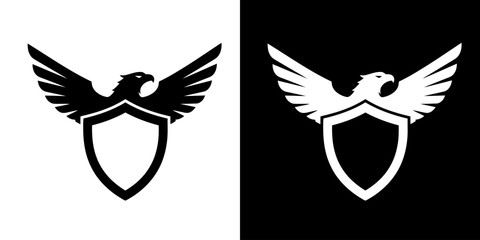 A black and white graphic of an eagle with outstretched wings perched on a shield.