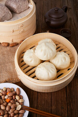 White Steamed Baozi Buns in Bamboo Steamer