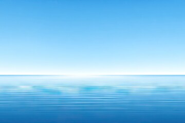Obraz premium Soft-focus view of a serene blue ocean meeting a clear sky