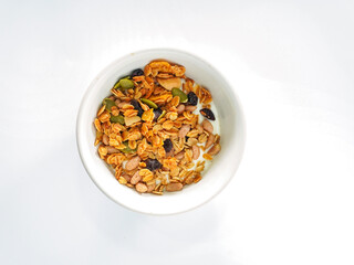 Granola mix grains Almonds bean on isolated white background. Food for energy breakfast, brunch snack. Healthy ingredients food contains nutrients protein, vitamins. Morning nutrition lifestyle food 
