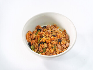 Granola mix grains Almonds bean on isolated white background. Food for energy breakfast, brunch snack. Healthy ingredients food contains nutrients protein, vitamins. Morning nutrition lifestyle food 