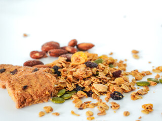 Granola mix grains Almonds bean on isolated white background. Food for energy breakfast, brunch snack. Healthy ingredients food contains nutrients protein, vitamins. Morning nutrition lifestyle food 