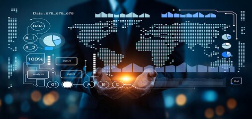 Business professional analyzing data with global map and graphs, showcasing digital analytics and information technology in modern corporate environment