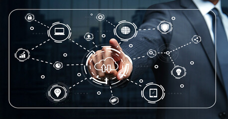 Business Professional Utilizing Digital Interface with Various Tech Icons Representing Connectivity and Data Management in a Modern Office Environment