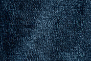 Very dark blue jeans texture background 