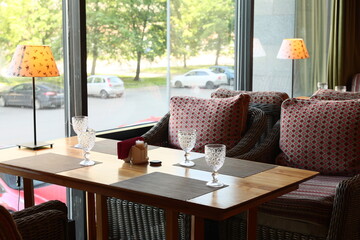 Enjoy a Cozy Restaurant Interior Featuring Comfortable Seating and Abundant Natural Light