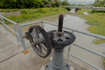 Close up of a floodgate control valve lock to control flooding of a river