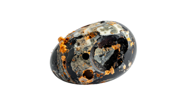 Black egg-shaped object with white and orange spots on a black background