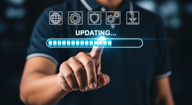 Man pointing at a digital screen showing a blue progress bar with the word UPDATING and various technology and security icons above